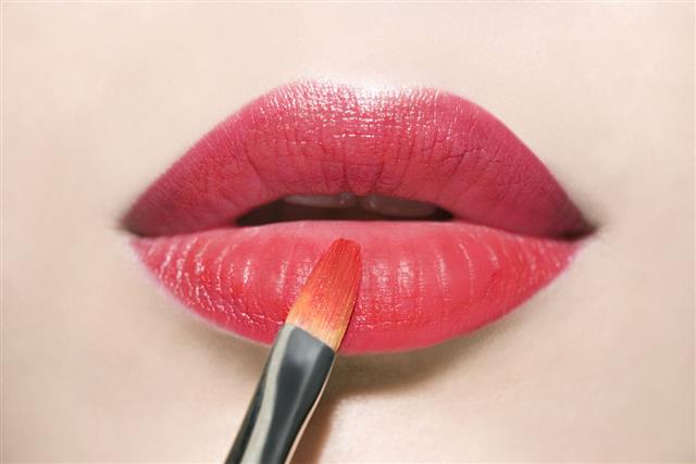 Applying Red Lipstick