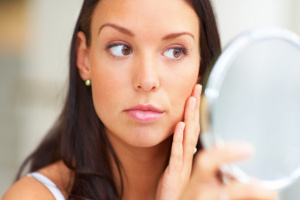 Woman touching face