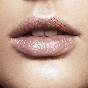 Apply lipstick over upper lip left side