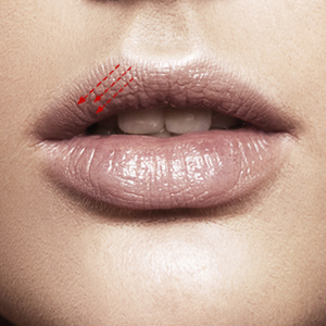 Apply lipstick over upper lip right side