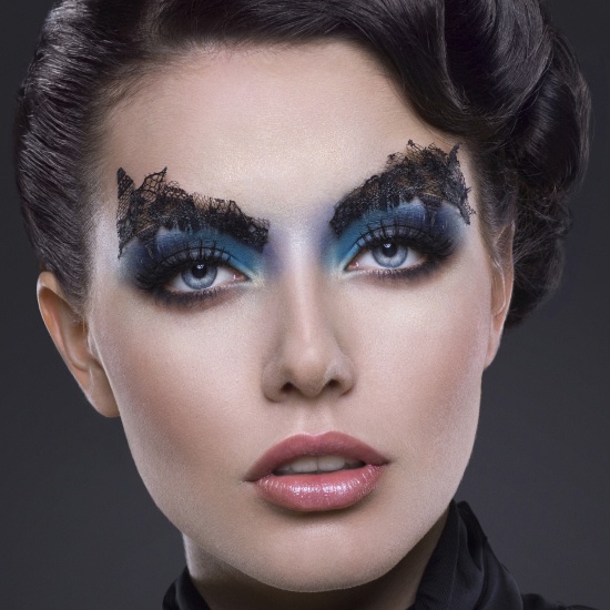 Avant-garde Eye Makeup with Blue Eyeshadow and Lace Eyebrows