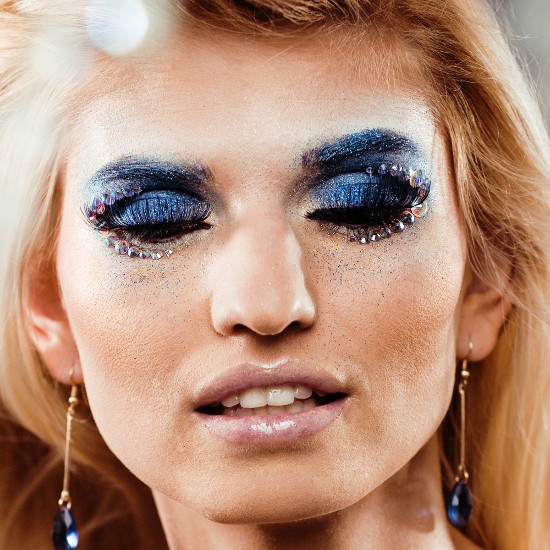 Avant-garde Eye Makeup with Blue Eyeshadow and Rhinestones