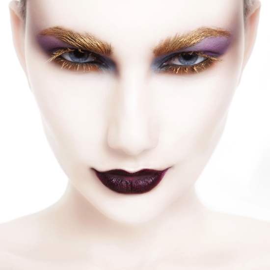 Avant-garde Eye Makeup with Gold Eyebrows and Lashes