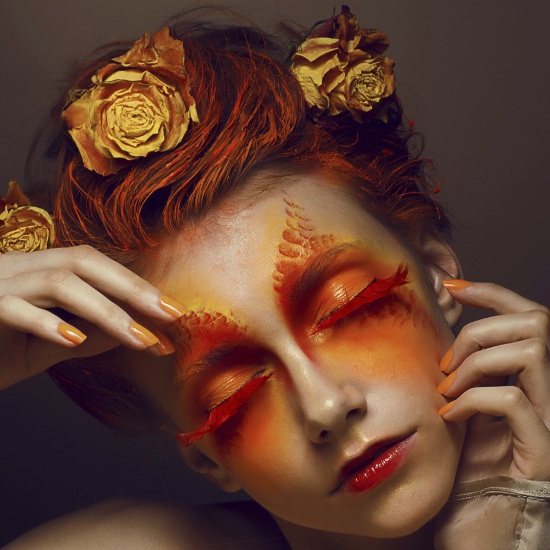 Avant-garde Eye Makeup with Orange and Red Eyeshadow and Lashes