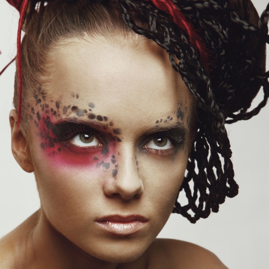 Avant-garde Eye Makeup with Red Eyeshadow and Black Spots