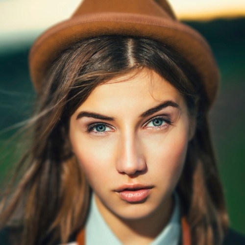 Hipster Woman with Light Makeup Nude Lips
